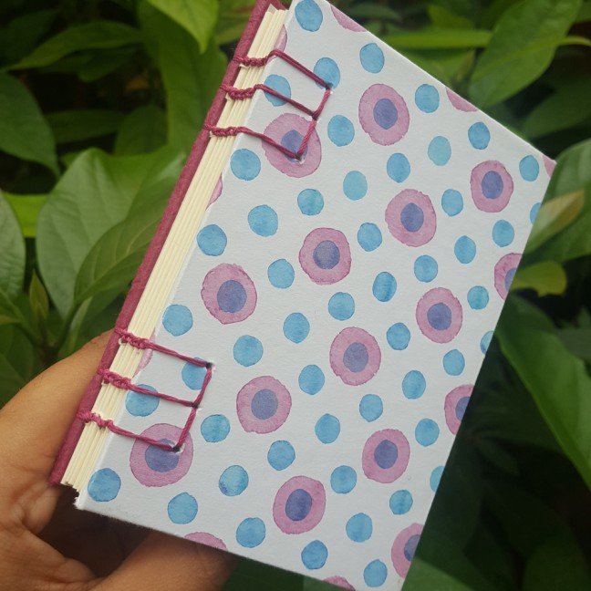 Small journal: magenta 
evil eye pattern