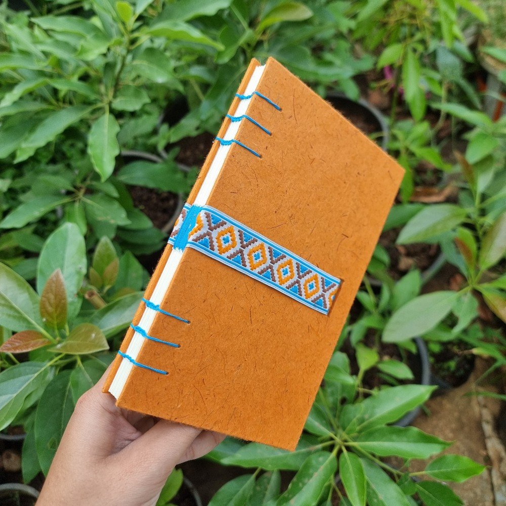 Journal: Orange with 
blue embroidered ribbon