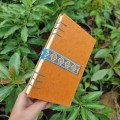 Journal: Orange with 
blue embroidered ribbon