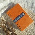 Journal: orange with blue embroidered ribbon