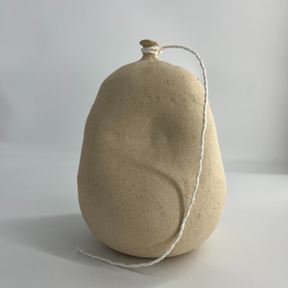 Beige Raw Clay Deflated Ceramic Balloon with One Dent