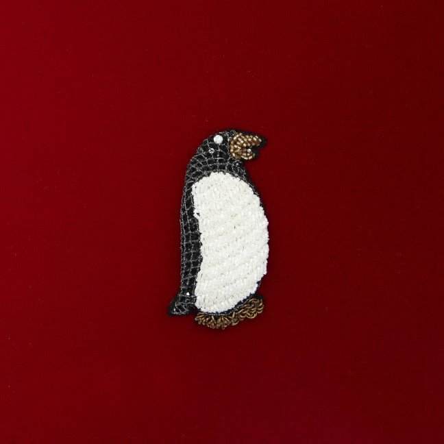 Hand embroidered red velvet penguin cushion